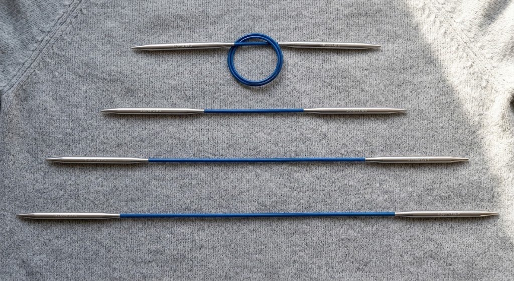 Circular knitting needles in different lengths arranged side by side for comparison