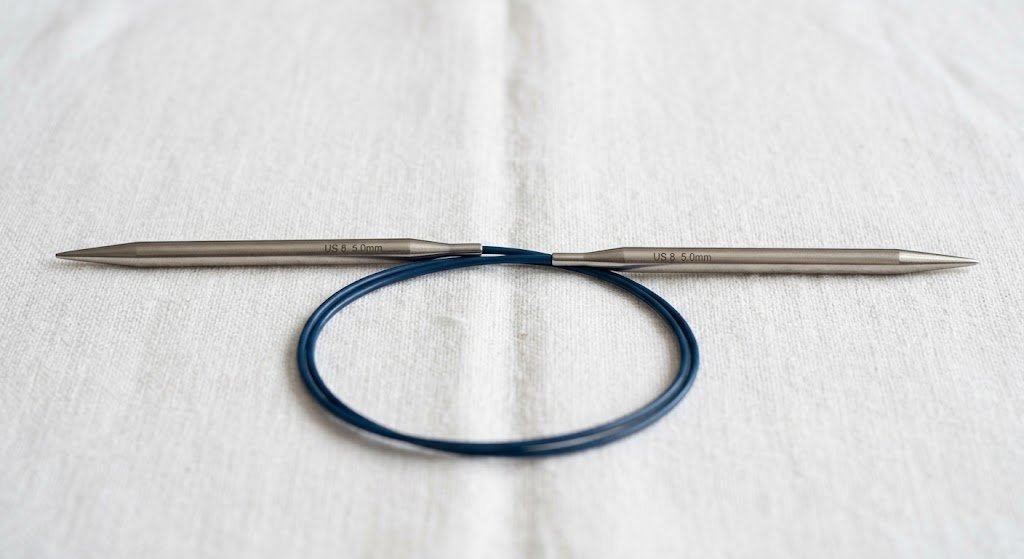 Circular knitting needle showing both needle tips and the connecting cable