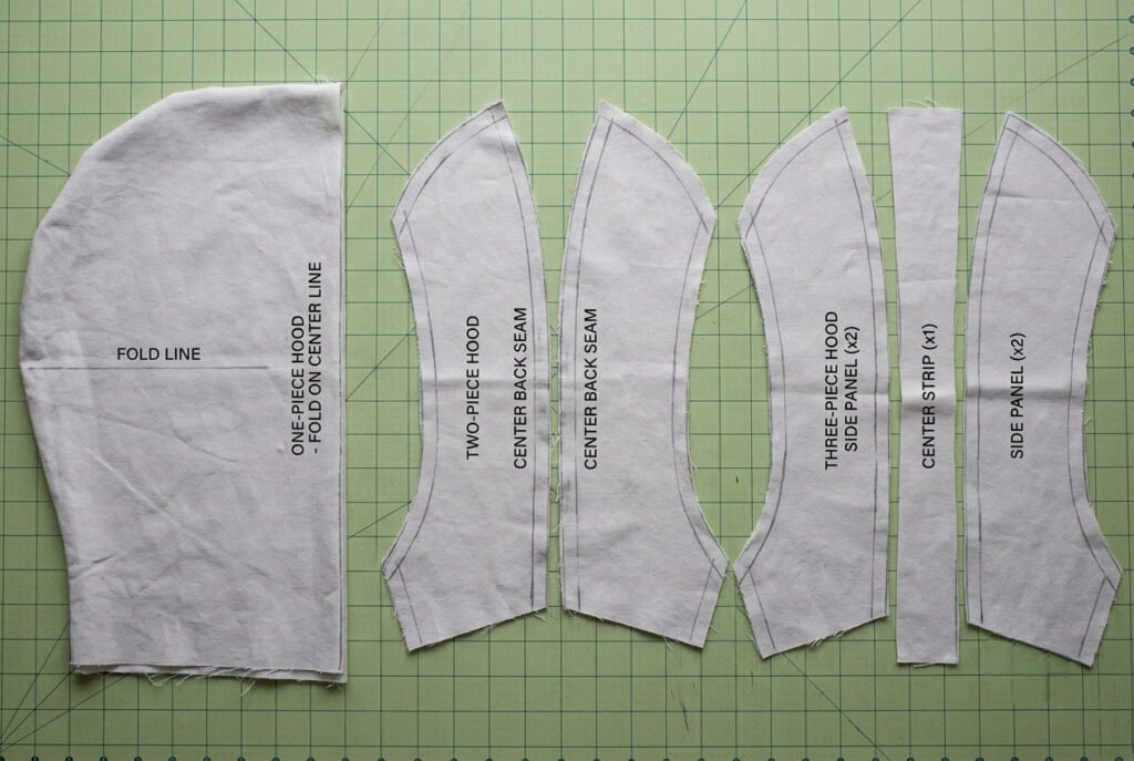 Comparison of one-piece, two-piece, and three-piece hood pattern shapes