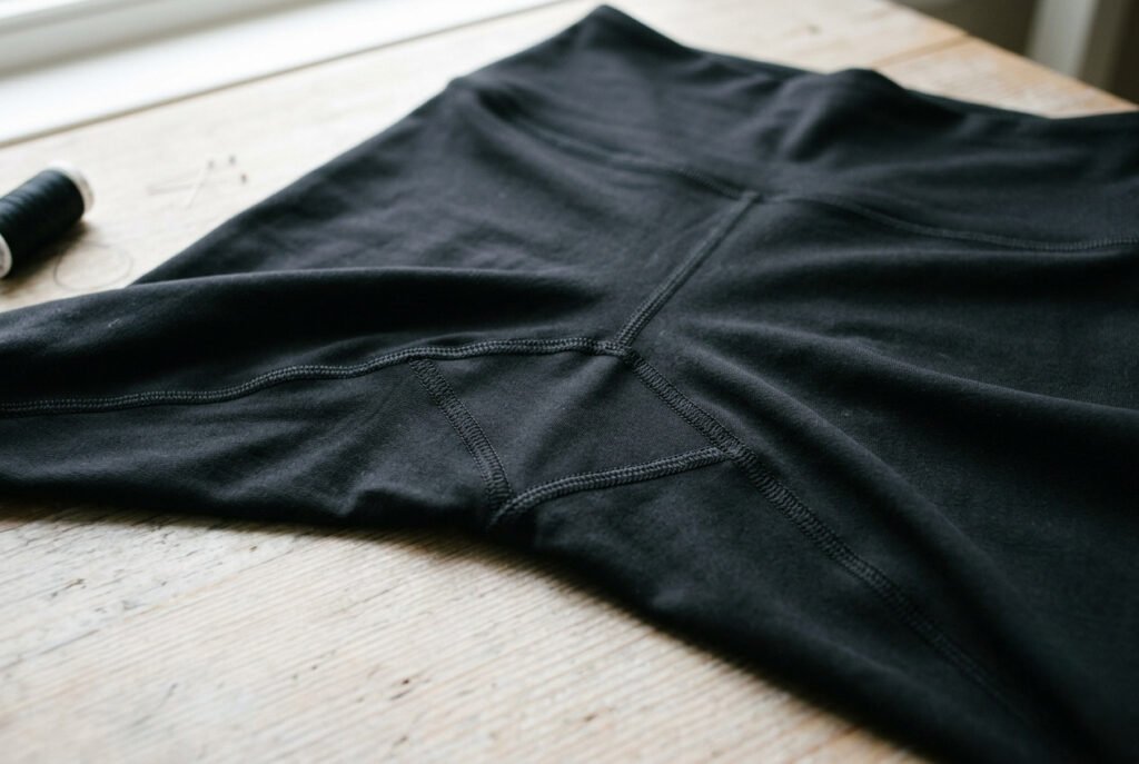 A diamond gusset being sewn into the crotch seam of a pair of leggings