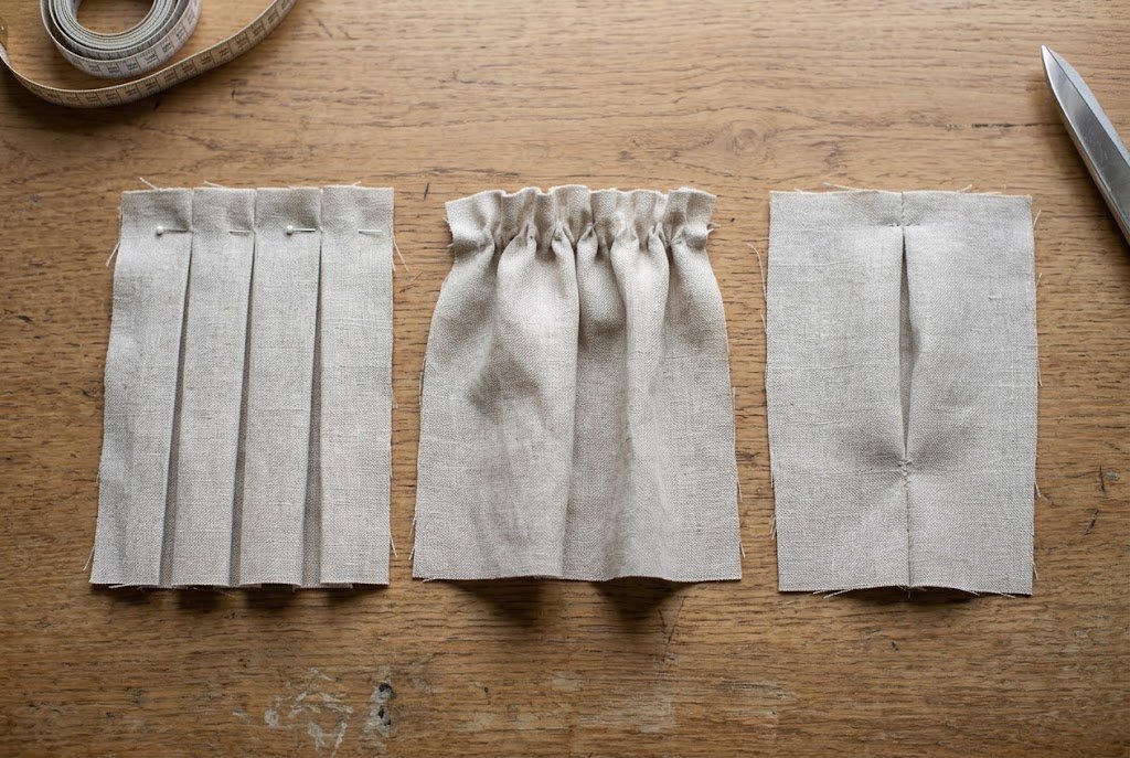 Three fabric swatches showing pleats, gathers, and a dart side by side