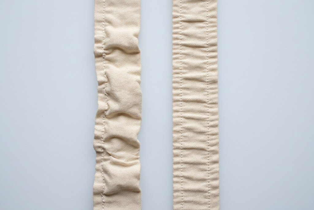 Wavy puckered casing compared with a smooth evenly gathered elastic waistband casing